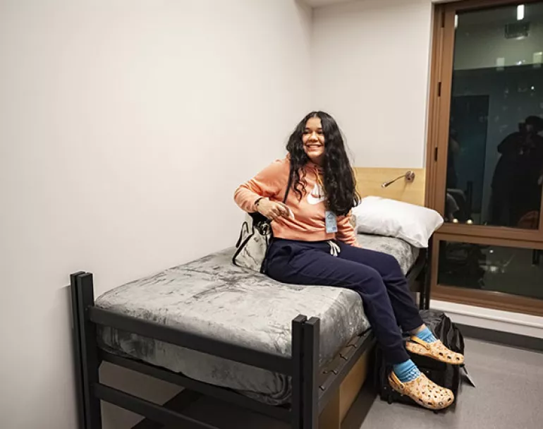Former homeless girl on new bed at homeless shelter | Covenant House 