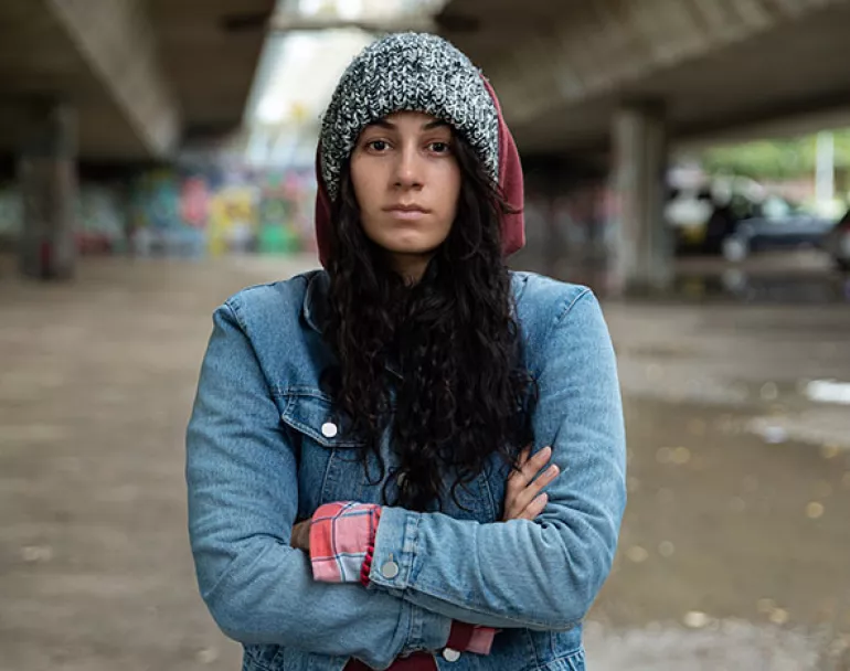homeless young woman standing outside in cold | Covenant House - Donate Now to help youth in need