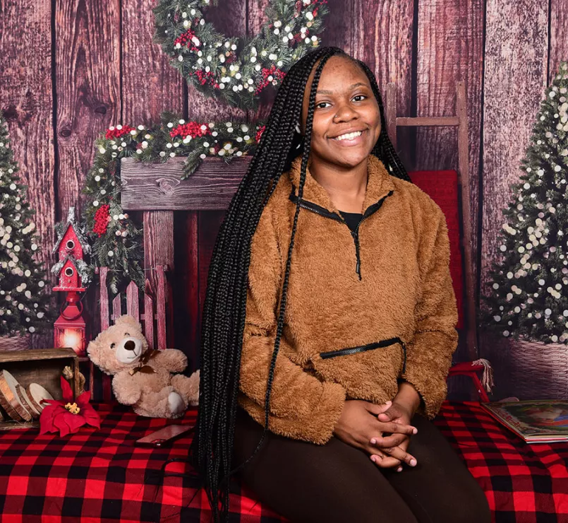 Young formerly homeless girl smiling during the holiday season
