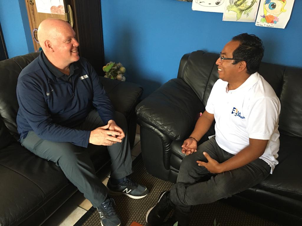 Covenant House Guatemala music teacher Esteban Monroy chatting with former Covenant House CEO Kevin Ryan 