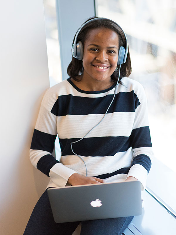 former homeless youth with laptop | Covenant House