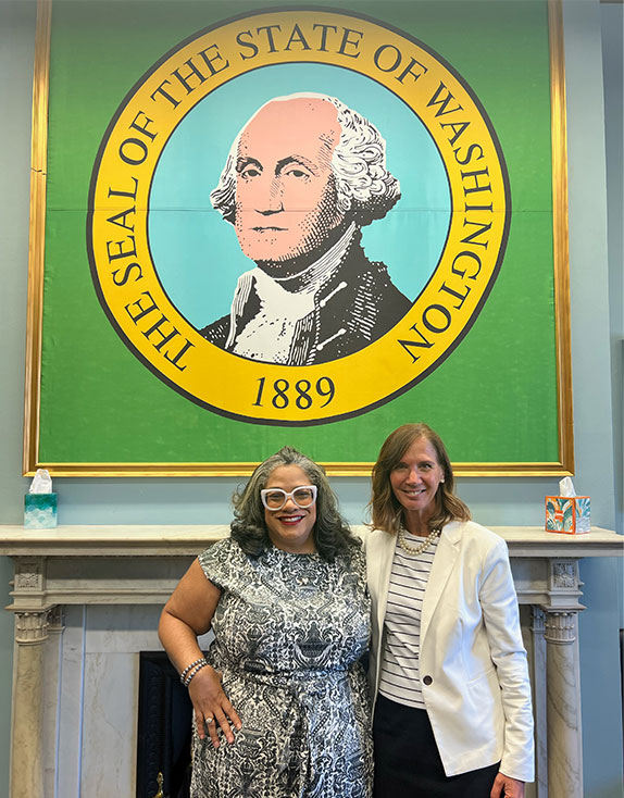 Covenant House Hill Day staff and advocates in front of The Seal of the State of Washington 1889