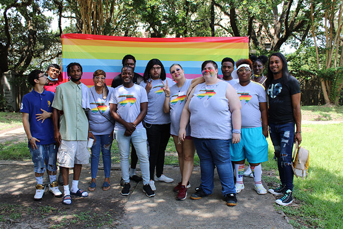LGBTQ+ youth with pride flag | Covenant House