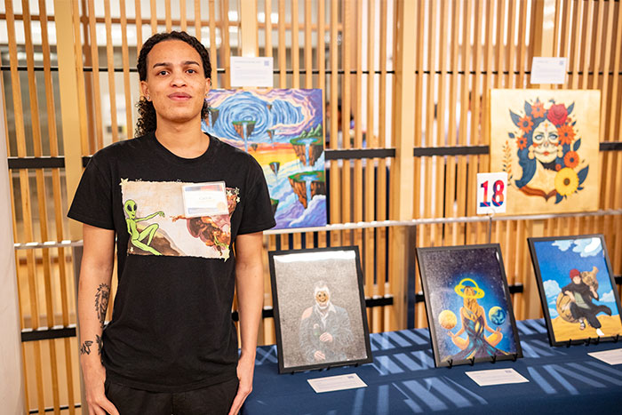 Covenant House NY youth artist with artwork at NYC youth art show 2026