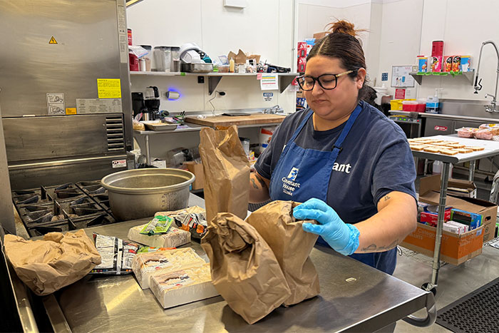 Covenant House Illinois Lead Cook, Ariana Carrera, prepping meals for homeless youth