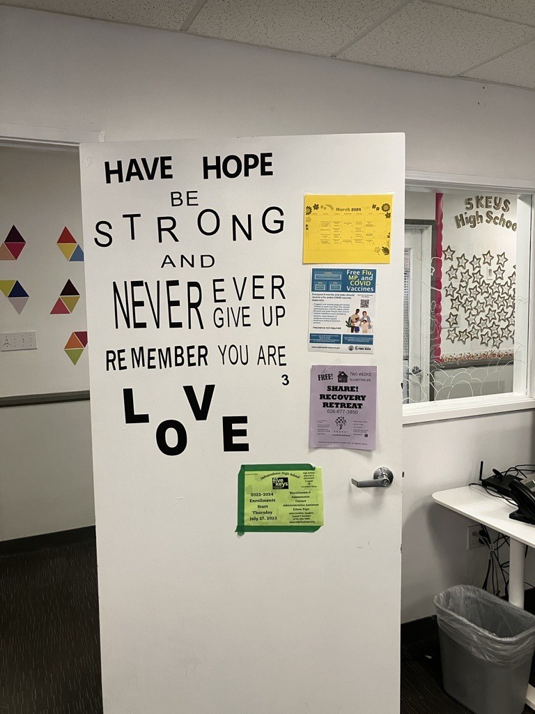 An interior door at one of the Covenant House California facilities that says, "Have Hope, Be Strong, and Never Ever Give Up; Remember You Are Love."