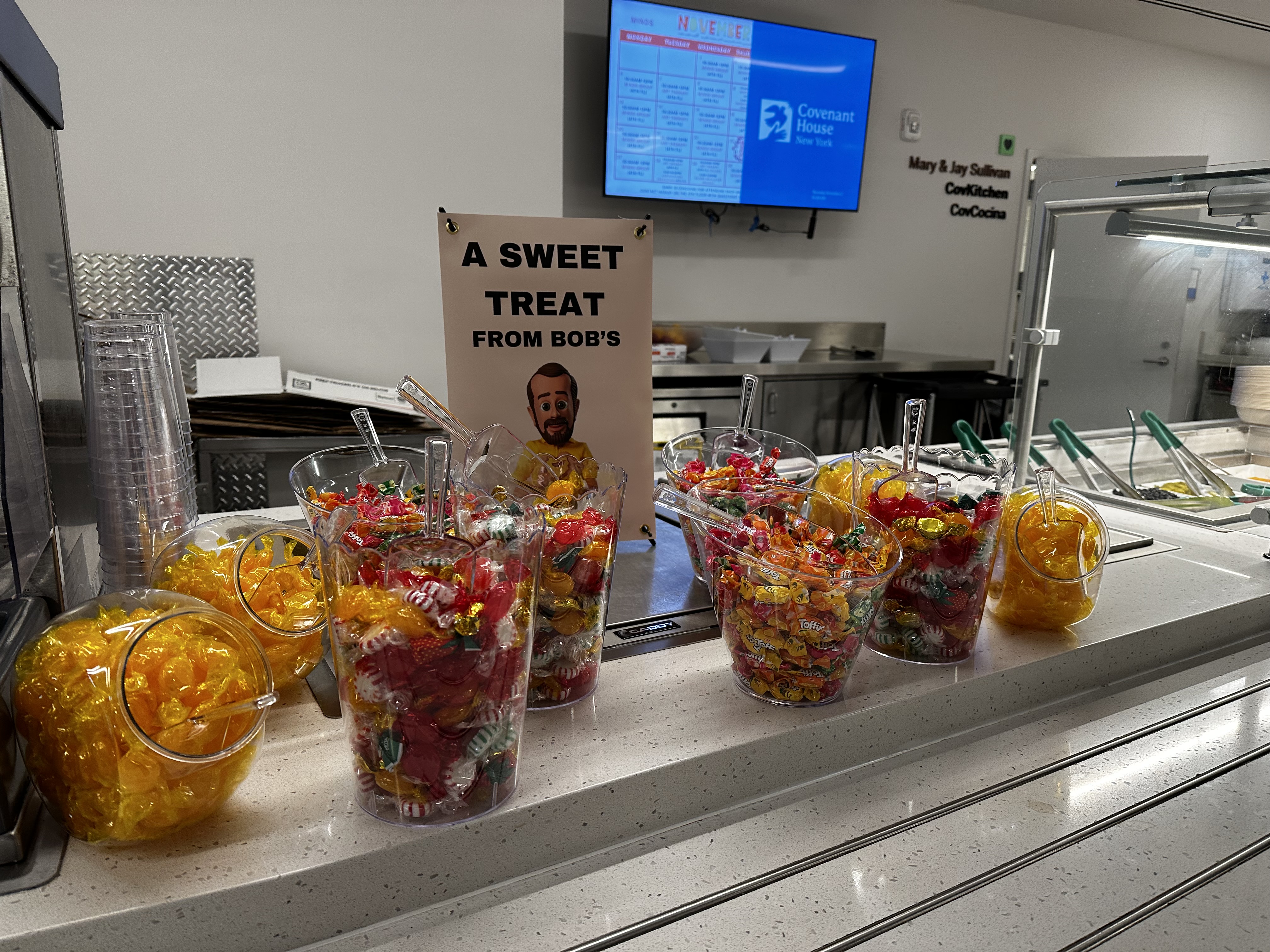 Cafeteria counter with "sweat treats" provided by Bob's Furniture at a Covenant House shelter location.