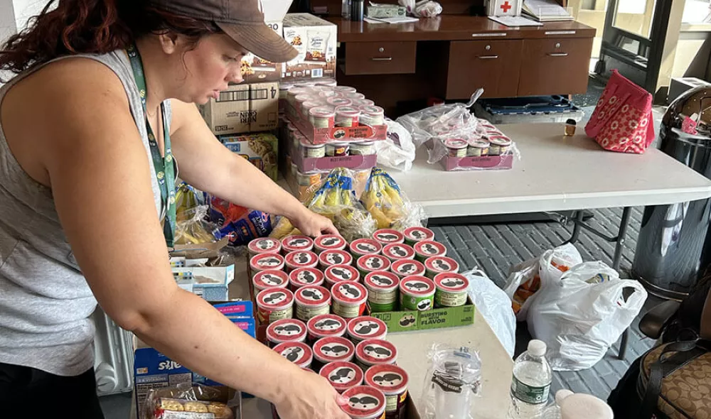 Staff getting food and snacks prepared for displaced youth during crane emergency in New York