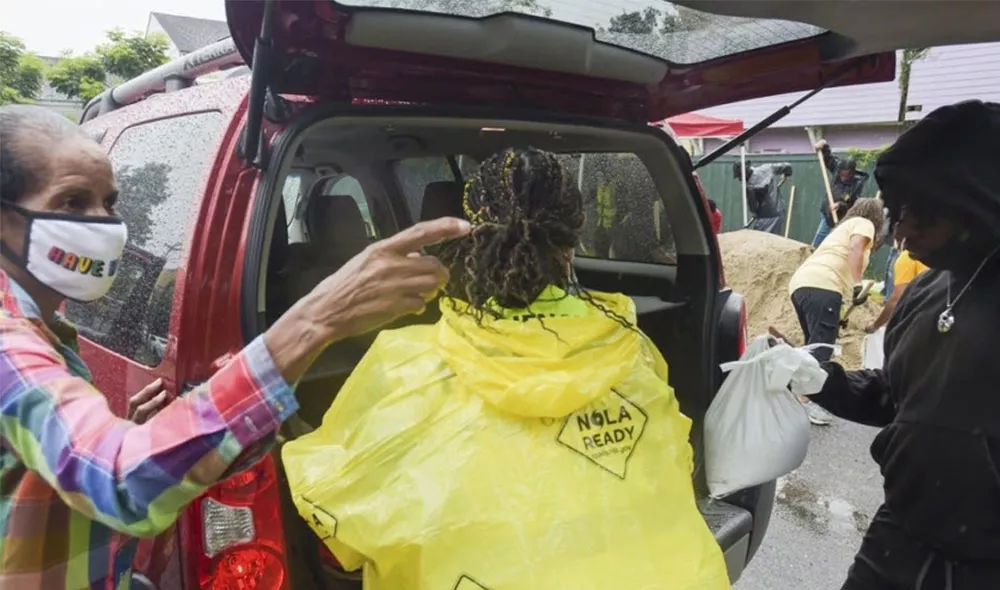 Hurricane Katrina van and survivors with supplies