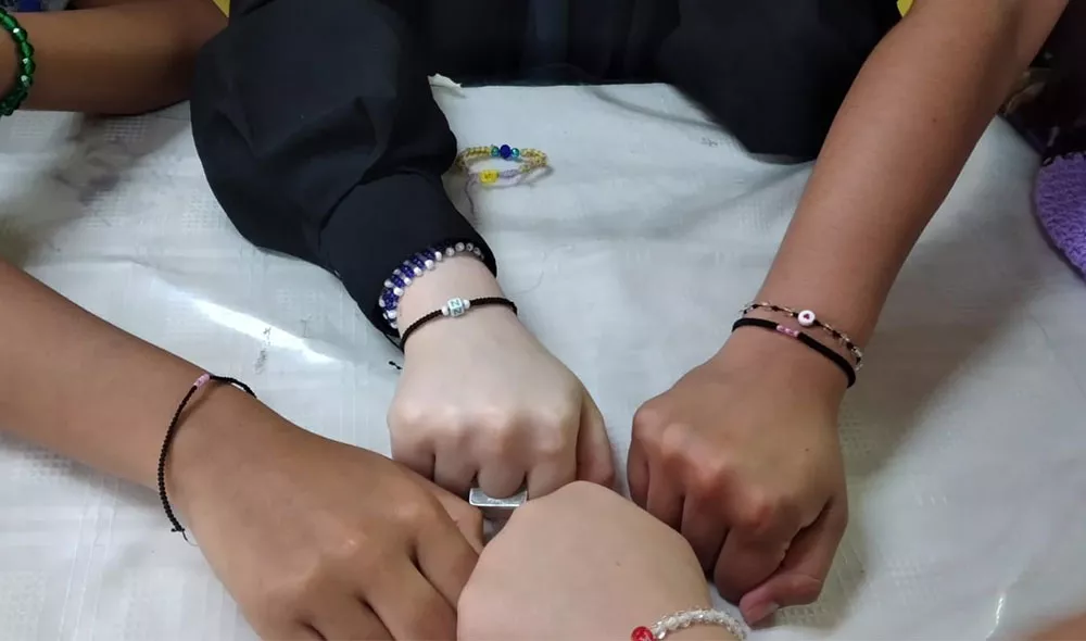 Covenant House youth hands together
