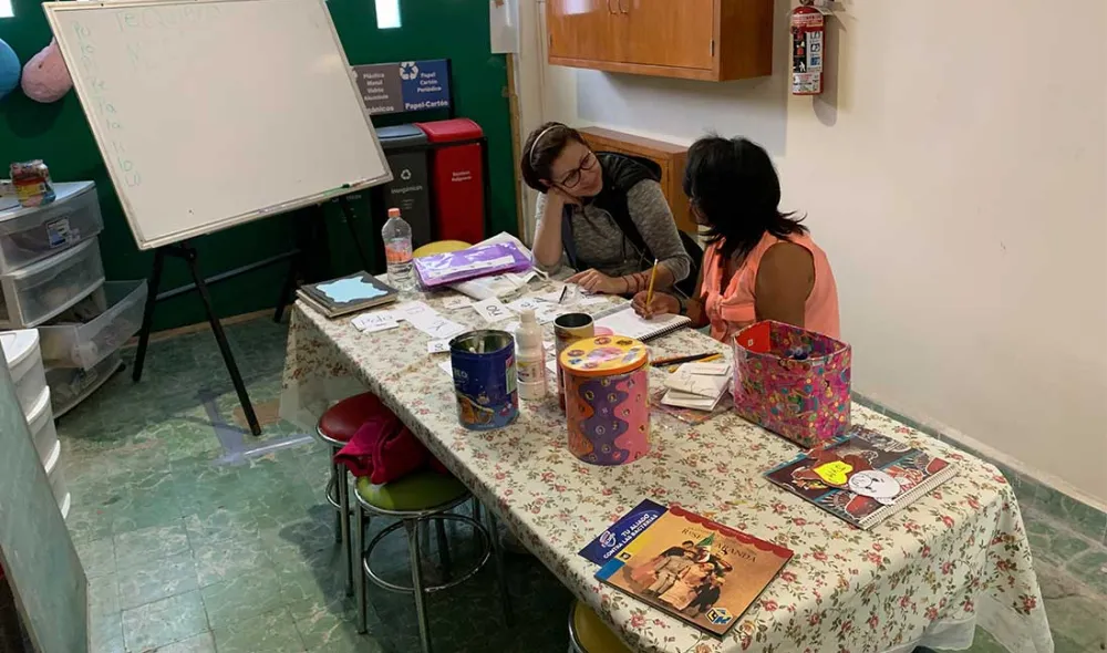 Covenant House Mexico homeless youth and staff engaged in learning 