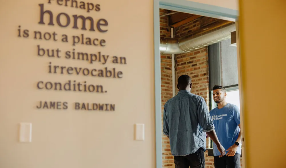 Covenant House Chicago employee talks to a resident in one of their state-of-the-art facilities.