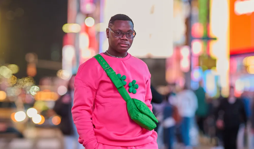 Mark, a former Covenant House New York resident, walking throughout Times Square.
