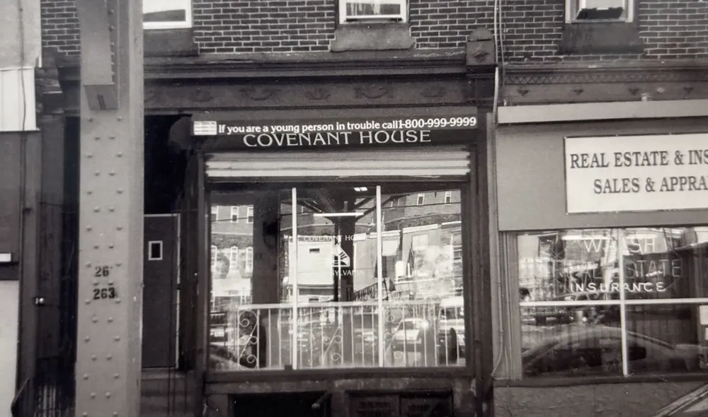 The storefront of Covenant House Pennsylvania's first location in Philadelphia over 25 years ago (in black and white).