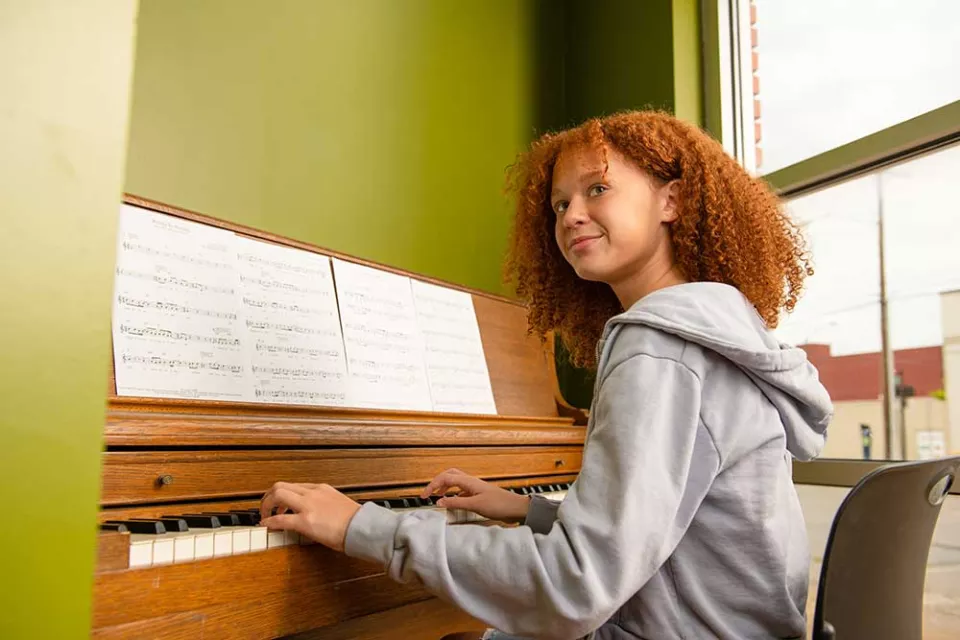 youth playing piano