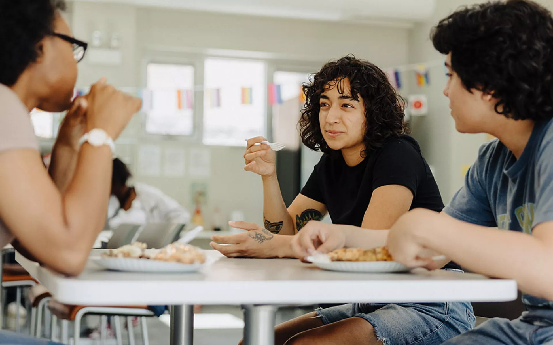 Previously homeless teens eating meals together at Covenant House 