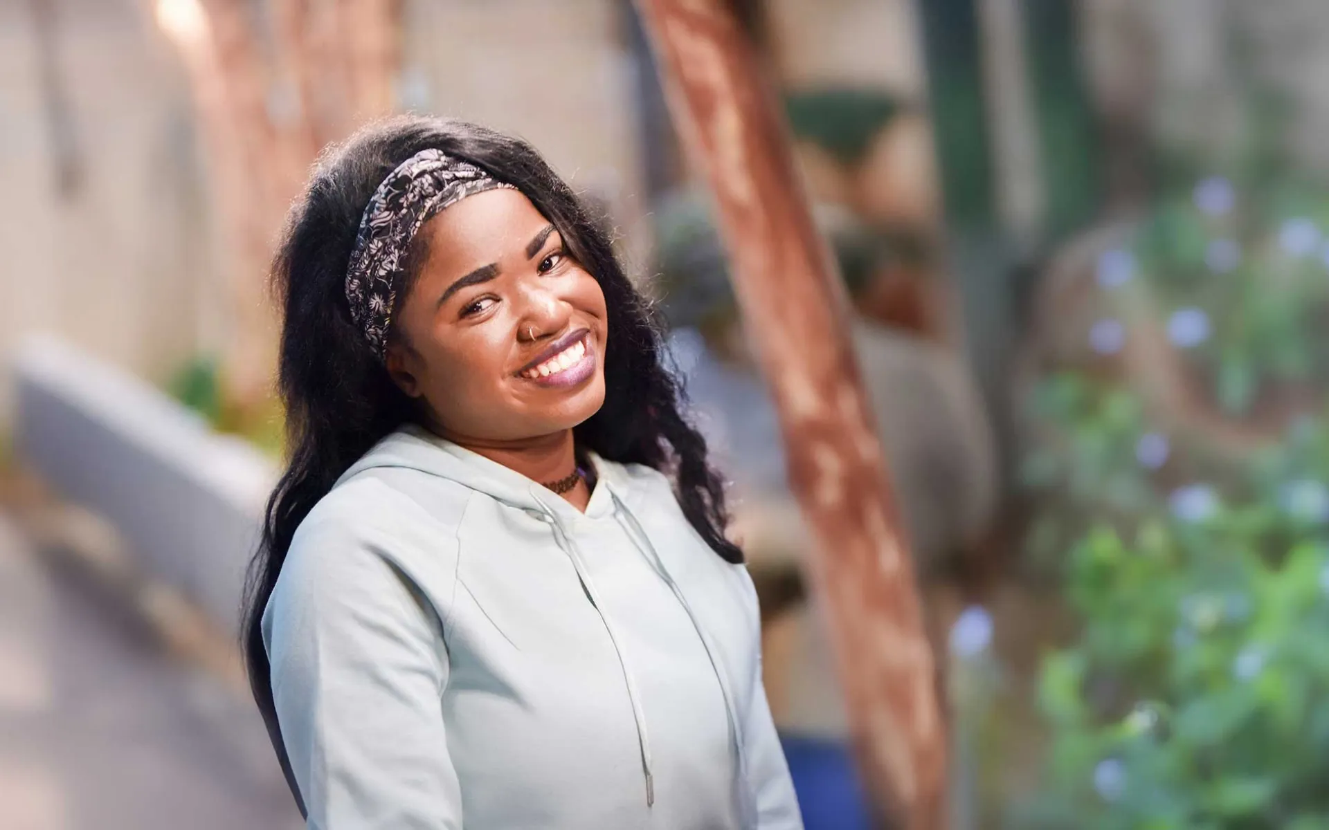 Smiling former homeless young person | Covenant House - Be An Angel Day