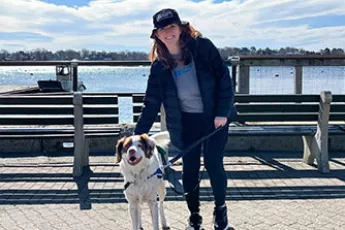 Covenant House Strides for Pride participant walking dog