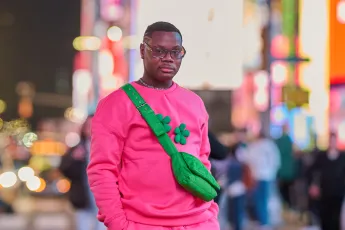Mark, a former Covenant House New York resident, walking throughout Times Square.