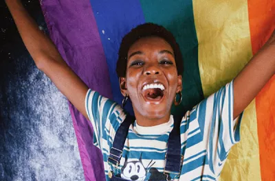 Woman holding a pride flag