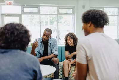 Former homeless teens socializing in Covenant House community room