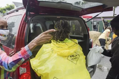 Hurricane Katrina van and survivors with supplies