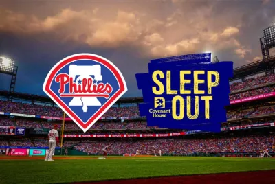 Phillies baseball logo and Covenant House Sleep Out logo with Citizen’s Bank Park as the background