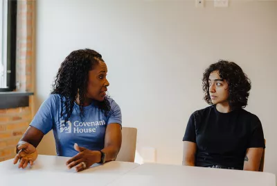 Covenant House homeless youth with staff in the middle of a conversation