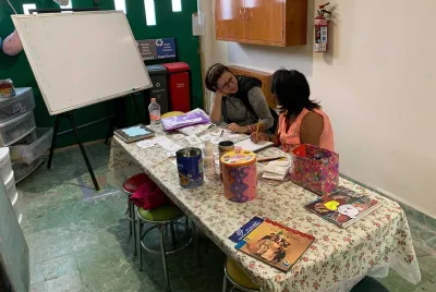 Covenant House Mexico homeless youth and staff engaged in learning 