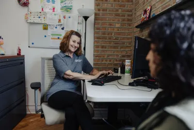 Covenant House counselor meeting with a young woman.