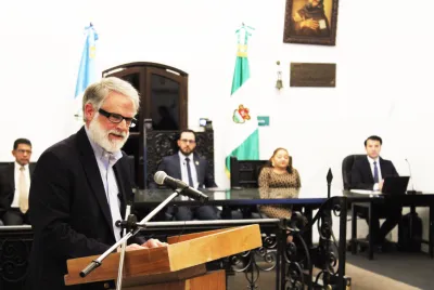 Longtime Covenant House supporter Andrew Bustillo addresses Antigua Mayor Juan Manuel Asturias Sueiras, municipal officials, and guests at a ceremony in Antigua, Guatemala, where he was recognized as a Distinguished Visitor.
