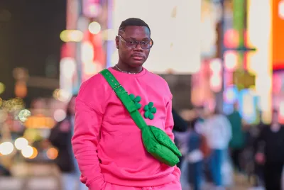 Mark, a former Covenant House New York resident, walking throughout Times Square.