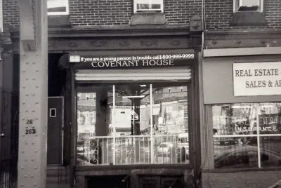 The storefront of Covenant House Pennsylvania's first location in Philadelphia over 25 years ago (in black and white).