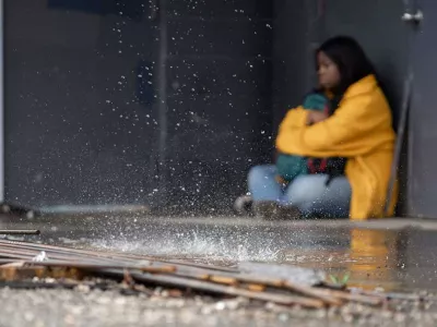 homeless youth trying to take shelter from rain | Covenant House