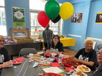 Covenant House Texas Juneteenth party with people dining