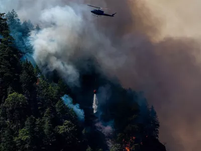 helicopter amongst wildfire | Covenant House