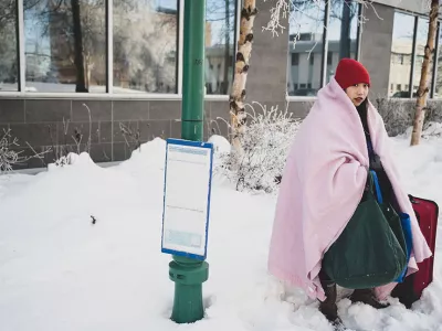 homeless girl outside with blanket and suitcase during the winter | Covenant House