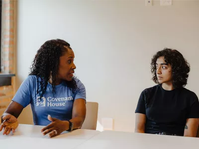 Covenant House homeless youth with staff in the middle of a conversation