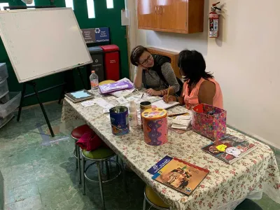 Covenant House Mexico homeless youth and staff engaged in learning 