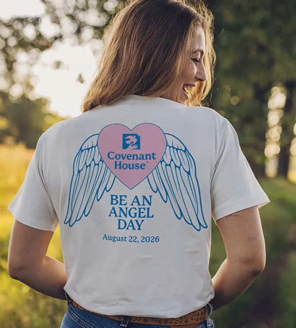 Youth in Need wearing a Covenant House Be An Angel Day T-Shirt