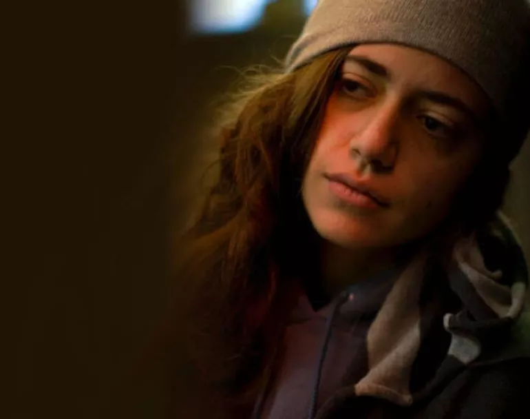 Young homeless youth on the street at night