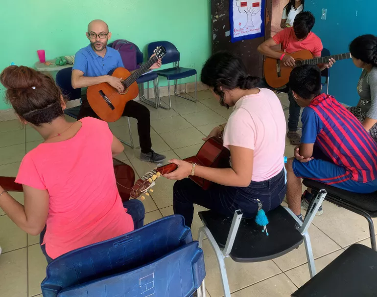 Guitar lessons at Covenant House Latin America