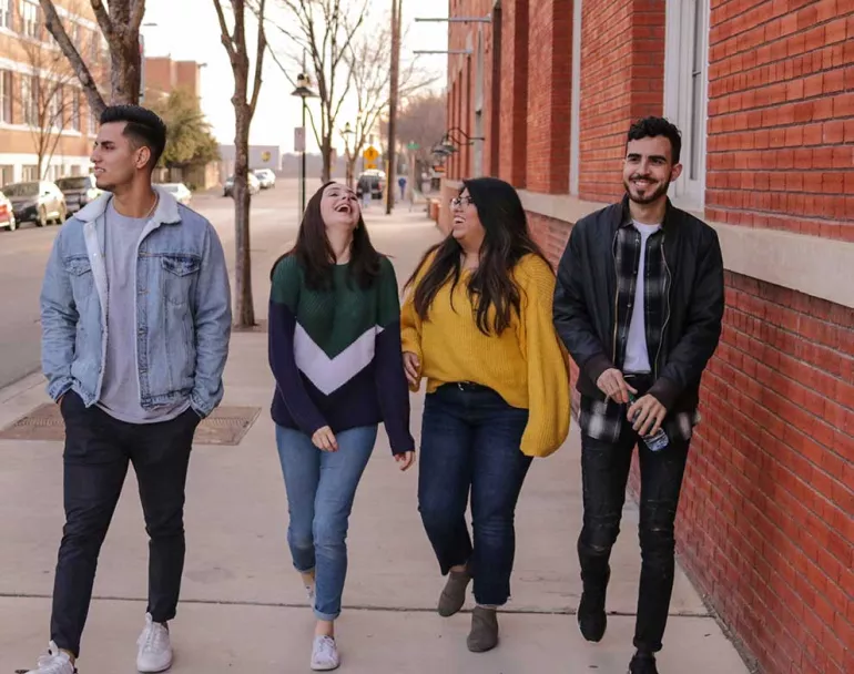 group of former homeless teens walking down sidewalk | Covenant House - Get Involved