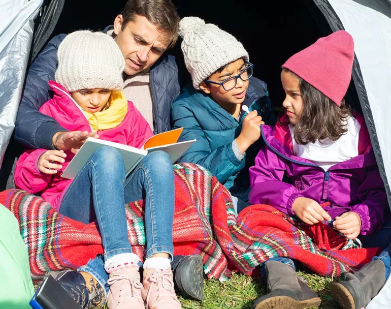 Latin American kids sitting in tent and receiving education | Covenant House - Latin America Public Education & Prevention