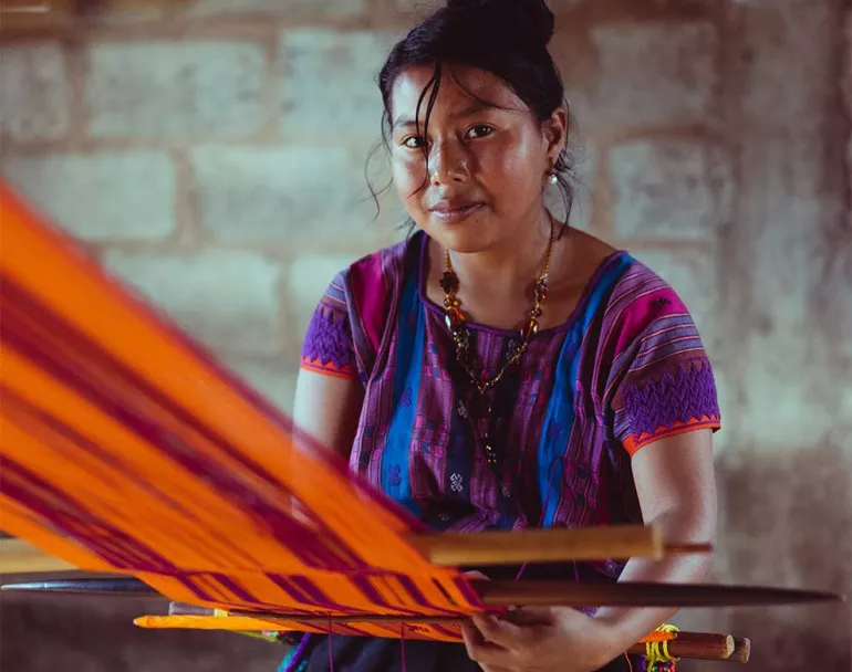 Former homeless Latin American girl weaving | Covenant House - Trafficking Survivors