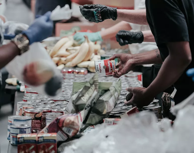 volunteers helping out with food pantry | Covenant House - Get Involved