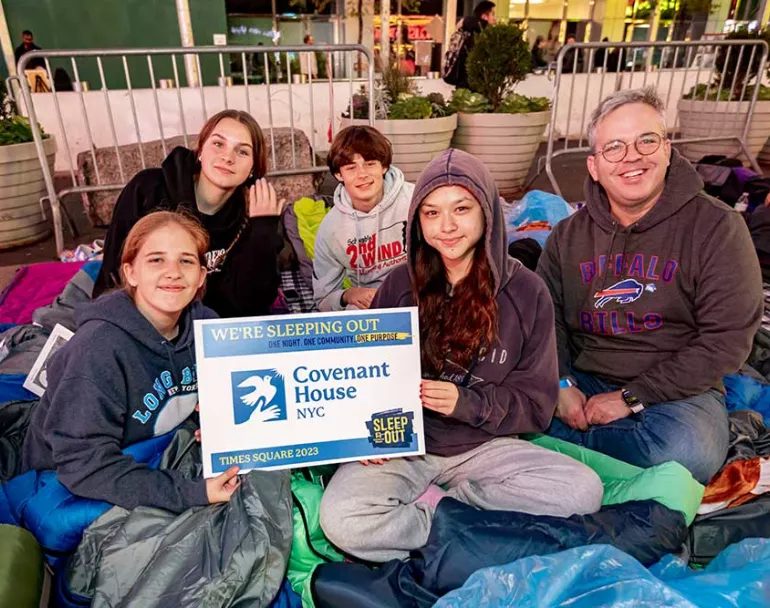 Covenant House Sleep Out volunteers on top of sleeping bags | Raising funds and awareness for homeless youth
