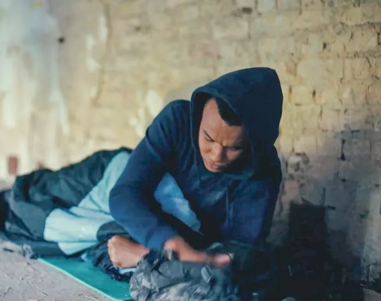 Save A Light | Young man sleeping on the streets