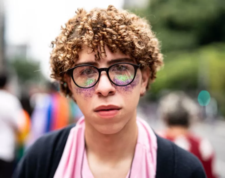 previous homeless LGBTQ+ youth outside celebrating Pride Month | Covenant House - Donate Now