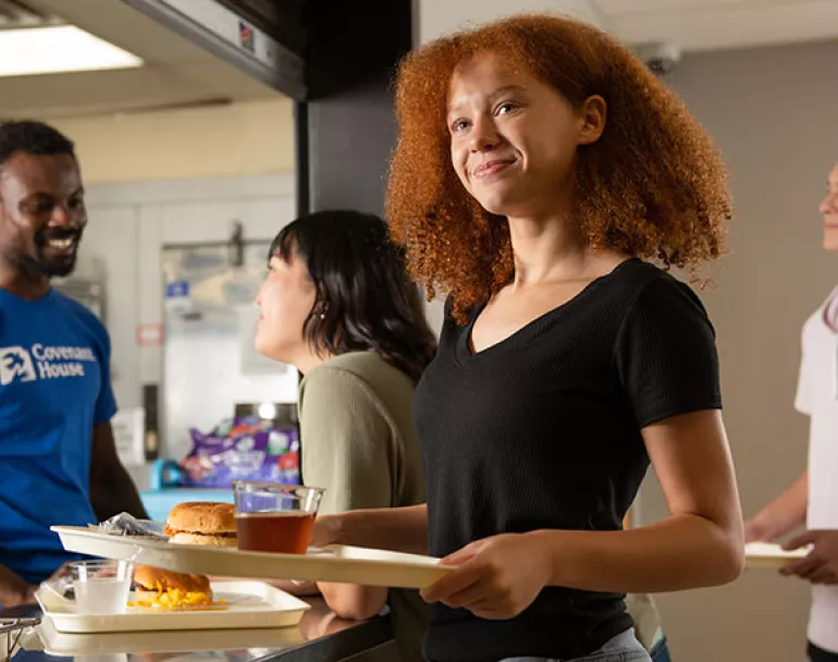 former homeless youth in cafeteria | Covenant House